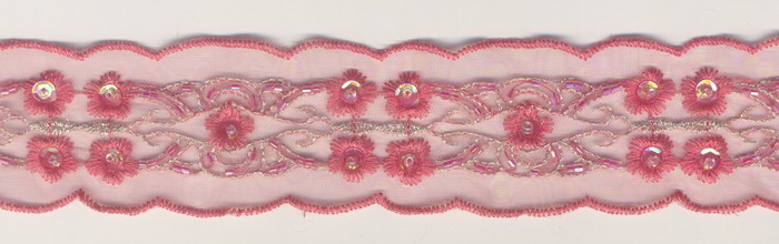 Lace.  Nail bead.  The bead embroiders the lace