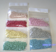 PP repro pellets in various light colors (pink, grey, red, blue, yellow, red, green)