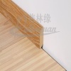 Laminated baseboard for laminate flooring