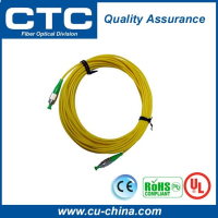 fiber optic patch cord in yellow jacket with green FC connectors
