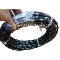 Spring diamond wire saw for marble quarrying