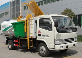 Self loading and unloading garbage vehicle