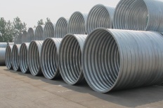 Annular flanged corrugated metal pipe
