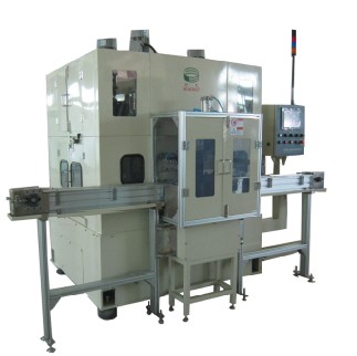 Piston deburring machine