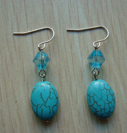 Earring is made of natural stone with acrylic beads.