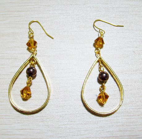 Earring is made of alloy with smoke topaz glass beads.